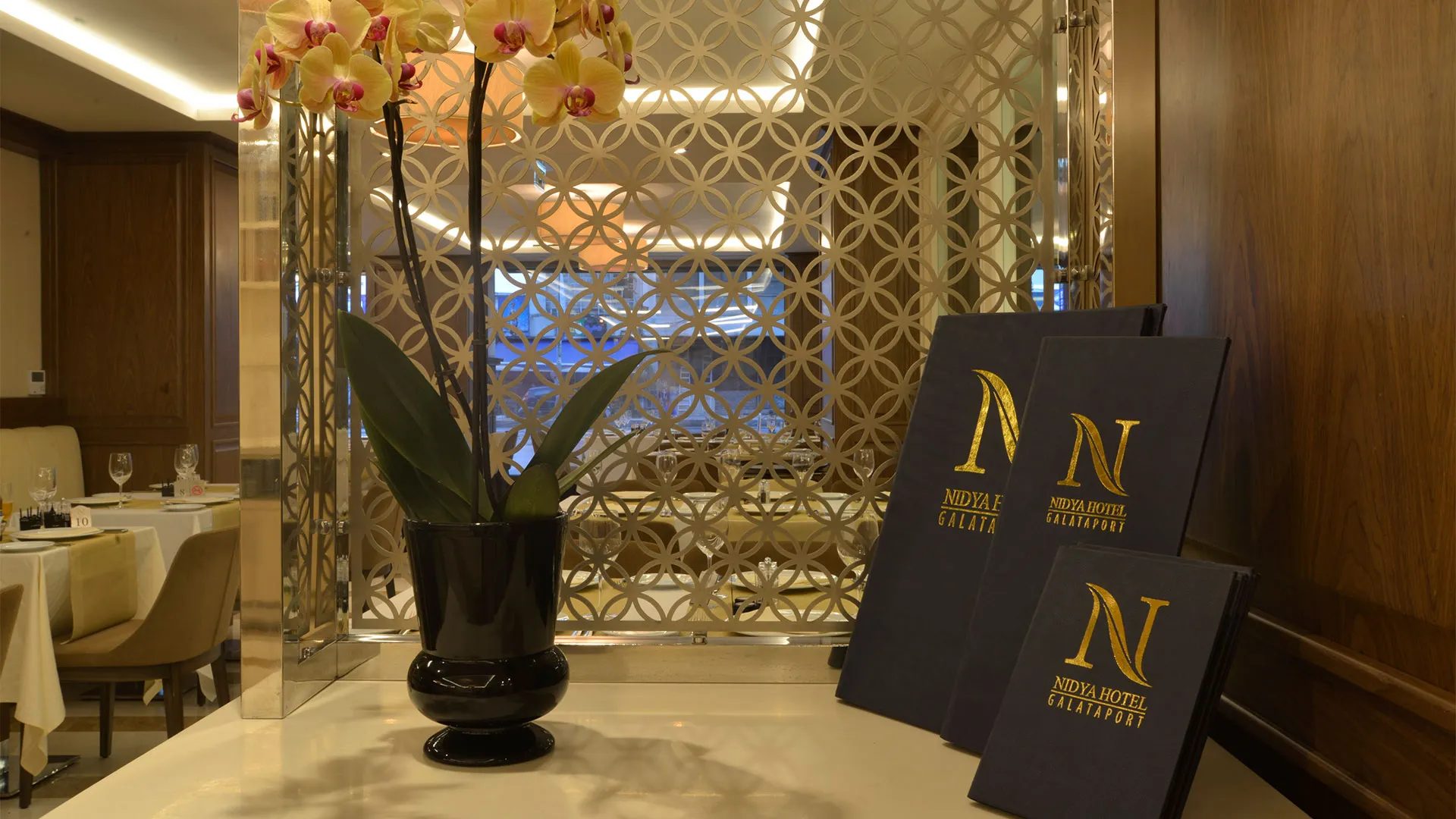 Nidya Hotel Galataport menus and an orchid
